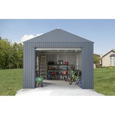 a garage with two bicycles parked in the front and one bicycle on the back side