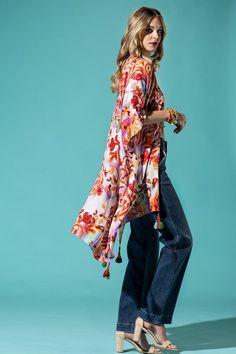 The bohemian wardrobe staple every woman needs! This stunning intricate bohemian print kimono features breezy side slits, half-length kimono sleeves, and a relaxed oversize fit. Throw it on at the beach for a quick cover-up or style it with your favorite jeans and a band tee for a cool everyday look. The gorgeous multicolor print will have you turning heads wherever you go! 100% Viscose Relaxed Oversized Fit Mid-length Side Slits Open Front Bohemian Style Length: 38" Width: 40" One size fits most Bohemian Printed Kimono For Beach Cover-up, Bohemian Rayon Cover-up For Vacation, Hippie Printed Kimono For Beach Cover-up, Bohemian Kimono With Boho Print For Beach Cover-up, Boho Print Cover-up With Kimono Sleeves For Beach Season, Boho Print Tunic Kimono For Beach Cover-up, Oversized Spring Tunic Cover-up, Bohemian Multicolor Tunic Cover-up, Long Hippie Kimono For Spring