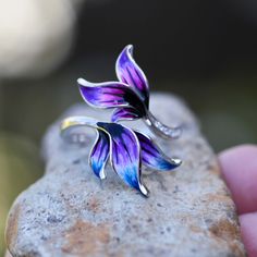 "I am no longer working with enamel so grab these while you can!! ( too many cheap copies of my work out there )- Hand Enameled - Colorful leaves, feather design  - 925 Sterling Silver - Cubic Zirconia This ring was made by first carving it in wax and then casting it. I usually make two at a time from one casting. This ring is really lovely, with a three dimensional leaf design that was enameled by hand. Since the enamel is done by hand each ring is a little bit different. If I don't have your size ready to go, get ahold of me. I don't always have the time but if I do, I will be happy to make it up for you in your size. This will come in a pretty gift box. Please note that I have only one of each size shown. Custom order sizes can be done as well. Please note custom sizes can take up to 8 Unique Enamel Flower Jewelry, Unique Enamel Flower Shaped Jewelry, Silver Flower Enamel Ring As A Gift, Nickel-free Purple Enamel Jewelry, Hand Painted Silver Flower Jewelry, Nickel-free Flower-shaped Enamel Jewelry, Silver Enamel Collectible Ring, Hand Painted Enamel Jewelry For Anniversary, Collectible Silver Enamel Ring