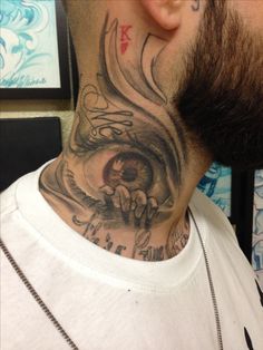 a man with a tattoo on his neck