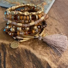 Modern Boho Mixed Wood & Beads Bracelet Stack Set Of 8 Bracelets Tasseled Approx Measurement 3” Diameter Stretchy (Except For Tasseled One.. It Does Not Stretch But Has Adjustable Closure) * Best Wear Tip: Slide Stretchy Beaded Bracelets Over Hand And Arm For Longest Wear And To Prevent Breakage. *Pair With Our Selection Of Sweet Stacks. *Next Business Day Shipping. Bracelet Stack Handmade Jewelry Boho Jewelry Sweet Stacks Bohemian Styles Jewelry For Her Personalized Jewelry Bracelets Chunky Bra Festival Brown Beaded Bracelets With Gold Beads, Bohemian Gold Bracelets With Dangling Beads, Adjustable Tassel Bracelets With Round Beads, Adjustable Round Beads Bracelets With Tassels, Adjustable Bracelets With Tassels And Round Beads, Adjustable Beaded Bracelets With Dangling Beads, Adjustable Gold Beaded Bracelets With Dangling Beads, Adjustable Brown Dangling Beads, Bohemian Brown Beaded Bracelets With Faceted Beads