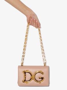 Shop pink Dolce & Gabbana DG Girls logo-embellished leather shoulder bag with Express Delivery - Farfetch Designer Crossbody Shoulder Bag With Logo Plaque, Luxury Crossbody Bag With Logo Plaque, Designer Crossbody Bag With Logo Plaque, Designer Rectangular Bag With Logo Plaque, Designer Gold Shoulder Bag With Logo Plaque, Designer Gold Bags With Logo Plaque, Designer Gold Bag With Logo Plaque, Luxury Rectangular Shoulder Bag With Gold-tone Logo Plaque, Gold Crossbody Bag With Logo Plaque