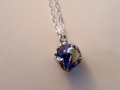 "Earth Globe Necklace Please review shipping policies (International customers, especially Blue Glass mounted with metal Earth map Size - 5/8\" diameter Chain: - Silver Plated over Brass CHOOSE YOUR CHAIN LENGTH from drop down menu tool. To view more items from our shop: https://www.etsy.com/shop/FashionCrashJewelry?ref=hdr_shop_menu INTERNATIONAL CUSTOMERS, PLEASE REVIEW MY SHIPPING & POLICIES FOR SHIPPING TIMES, AND POSSIBLE CUSTOM/DUTY FEES! You may view my shop policies here: http://www. Silver Jewelry With Ball Chain For Gift, Pendant Jewelry With Ball Chain As Gift, Round Pendant Ball Chain Jewelry Gift, Round Pendant Ball Chain Jewelry As Gift, Round Pendant Ball Chain Jewelry For Gifts, Blue Necklace For Christmas Gift, Blue Jewelry Christmas Gift, Blue Jewelry For Christmas Gift, Blue Metal Round Pendant Jewelry