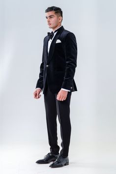 Black velvet tuxedo with shawl lapel collared neckline. Paired with white shirt, trouser, bow and waist band.
Components: 5
Type Of Work: Plain
Neckline: Shawl lapel collar
Sleeve Type: Full sleeves
Fabric: Velvet
Color: Black
Other Details: 
Front button detailing
Cuff sleeve hem
Note: Pocket square worn by the model is not for sale
Occasion: Cocktail and Reception - Aza Fashions Luxury Gala Suits For Formal Occasions, Luxury Three-piece Suit For Party, Designer Evening Tuxedo With Lapel Collar, Luxury Shawl Collar Suit For Formal Occasions, Luxury Tuxedo For Semi-formal Gala, Luxury Tuxedo For Semi-formal Gala Events, Luxury Wedding Blazer With Shawl Collar, Luxury Semi-formal Tuxedo For Gala, Luxury Shawl Collar Wedding Blazer