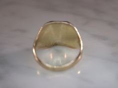 Herff Jones Art Deco style 10k yellow gold ring is size 7. Band tapers from 15mm to 3mm with beveled plaque on top. Plaque design consists of a shield with the name of the school engraved on it, which is too worn to see. Bevels are decorated with geometric patterns and engraved with the letters D and J. The sides of the ring have the numbers 19 and 36 incised into them, all in a high polish finish. Stamped HJ.CO SUPERTONE PATENTED. 14k Gold Signet Ring With Polished Finish, 14k Gold Art Deco Signet Ring With Polished Finish, Octagon Signet Ring With Polished Finish For Anniversary, Art Deco Gold Signet Ring With Polished Finish, Art Deco Rectangular Signet Ring With Polished Finish, Collectible Art Deco Signet Ring With Polished Finish, Classic Octagon Signet Ring With Polished Finish, Gold Signet Ring With Polished Finish, Herff Jones