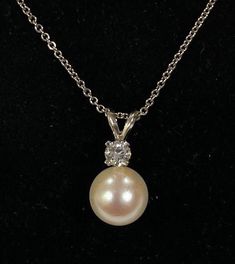 "Pearl pendant contains one 9mm Akoya pearl and one round brilliant cut earth mined diamond weighing .20ct SI-1 clarity H color. Mounting is 14kt white gold with diamond set in 4 prongs 16\" 14kt white gold chain 1.7g. Money back guarantee within 14days. Buyer pays return shipping and must be returned in original condition with box and no alterations." Diamond White Necklace With Pearl Pendant, Anniversary Akoya Pearl Diamond Necklace With Pearl Pendant, Diamond Pearl Drop Necklace, Pearl Necklace With Diamond And Round Pendant, Diamond White Pearl Necklace With Diamond Pendant, Diamond White Diamond Pendant Pearl Necklace, White Gold Pearl Necklace With Diamond Accents, Diamond White Necklace With Pearl Pendant For Formal Events, Diamond White Necklace With Pearl Pendant For Formal Occasions