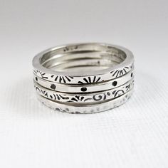 A set of four stacking rings are hand fabricated from sterling silver. They've been stamped with patterns and have been hammered. MEMBER - Nina Gibson Designs Sterling Silver Rings Boho, Metal Stamped Jewelry, Stacker Rings, Stamped Rings, Metal Clay Jewelry, Dope Jewelry, Jewelry Lookbook, Stamped Jewelry, Jewelry Inspo