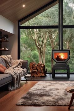 a living room filled with furniture and a fire place in front of a large window