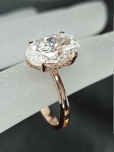 a close up of a ring with a large diamond on it's shants