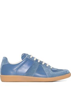 Replica low-top leather sneakers from Maison Margiela featuring blue, leather, suede panelling, signature single-stitch logo, signature numbers motif, logo patch at the tongue, round toe, front lace-up fastening, branded insole, full lining and gum-rubber sole. Blue Leather Sneakers With Stitched Sole, Margiela Tabi Sneakers, Maison Margiela Replica Sneakers, Maison Margiela Shoes Sneakers, Margiela German Army Trainers, Margiela Sneakers, Margiela Replica, Embroidery Shoes, Sneakers Blue