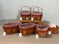 several baskets are arranged on a table with numbered labels and numbers in front of them