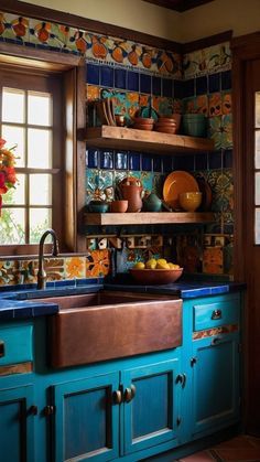 a kitchen with blue cabinets and colorful wallpaper