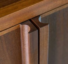 a close up view of a wooden cabinet door