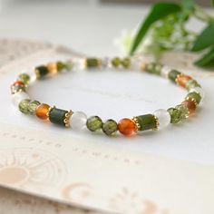 Olive Green Crystal Jade Mixed Bracelet, Simple Green Minimalist Bracelet, Green Everyday Wear Bracelet Gift 🤍 Handmade with Love ✨ Unique Design 🎁 Gift Ready 💟 M A I N ∙ M A T E R I A L ➙ Jade ➙ Clear Quartz ➙ Orange Agate ➙ Green zircon faceted beads 💟 S I Z I N G ➙ Elastic ➙ Size: 6 1/2" 💟 P A C K A G I N G  ➙ All items are nicely packaged ready to gift in elegant jewelry boxes. 💟 S H I P P I N G ➙ United States: 3-7 business days to arrive（Priority Mail: 2-4 business days to arrive) ➙ Olive Bracelet, Green Minimalist, Orange Agate, Bracelet Simple, Vert Olive, Simple Green, Stone Pattern, Minimalist Bracelet, Green Crystal