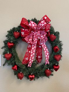 a wreath with red and white hearts on it