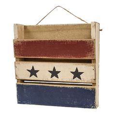 an old wooden box with stars painted on the outside and red, white, and blue