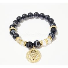 Lion Bracelet/Gold Plated/Agate Black Beaded/Stretchy/Gemstone/Handmade Jewelry/Gifts One beautifully handcrafted beaded bracelets. Great for casual wear or dressing up with. Also great gift idea for the holidays. Made with smooth black agate gemstone beads and featuring a Gold Plated Lion Charm. This is a stretch bracelet so it should be very comfortable to wear on any size wrist. Decorate your arm with R&R Wrist Candy Today =) 10mm Beads ♥Agate Beads are believed to have healing properties Lion Bracelet, Lion Charm, Wrist Candy, Bohemian Bracelets, Handmade Beaded Jewelry, Handmade Jewelry Gift, Black Agate, Bracelet Gold, Agate Beads