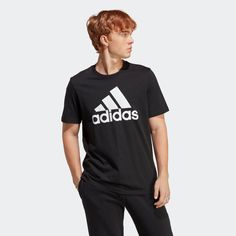 Whether it's post-gym or a fresh morning start, answer the call of this adidas staple tee. Designed for comfort and effortless style, the iconic adidas Badge of Sport takes the spotlight, showcasing your adidas pride in full force. Versatility is keyeffortlessly pair it with anything in your wardrobe for that timeless sports vibe. Regular fit. Ribbed crewneck. Fabric: 100% cotton single jersey. Supports the Better Cotton Initiative. Imported. Single Shirt, Adidas T Shirt, Adidas Sportswear, Mens Essentials, Adidas Logo, Logo T Shirt, Adidas Men, Emporio Armani, Tshirt Logo