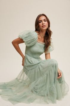 Beautiful tulle mint green dress with smocked bodice, with fun puff sleeves, ruffle detailing, elastic waistband and square neckline. Self and Lining 100% Polyester Hand wash in cold water. Aprox. measurements in inches: S:Length of self-46, length of lining-42 |Bust-28 |Waist-26 M:Length of self-47, length of lining-42.5 |Bust-30 |Waist-28 L:Length of self-47, length of lining-43 |Bust-32 |Waist-29 modest dresses, modest dress, modest midi, modest maxi, modest fashion, modest trendy dresses, mo Modest Tulle Dress, Modest Prom Dress, Modest Prom Dresses, Modest Midi Dress, Modest Formal Dresses, Nursing Friendly Dress, Light Green Dress, Modest Maxi, Mint Green Dress