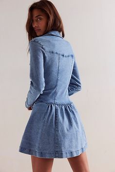 An elevated take on the classic denim dress, this mini is featured in a flattering drop-waist silhouette and long-sleeve style with a flouncy skirt and button-front closures. **Fit:** Fitted bodice, relaxed skirt, A-line hem **Features:** Soft cotton denim with a stretchy feel, collared-neckline, button-front closures, chest-pocket detailing, defined seams throughout, flared skirt, cuffed long-sleeves **Why We ❤ It:** This denim mini is perfect for pulling on no matter the season. | Roadhouse Mi Chic Long Sleeve Denim Mini Dress, Long-sleeve Denim Dress For Casual Spring Wear, Chic Long Sleeve Medium Wash Denim Dress, Long Sleeve Denim Dress For Casual Spring Days, Long Sleeve Denim Dress For Casual Spring Wear, Long Sleeve Denim Dress For Dress Down And Spring, Fitted Long Sleeve Denim Dress For Work, Chic Washed Long Sleeve Denim Dress, Chic Long Sleeve Denim Dress