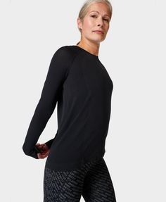 A new, lighter version of our bestselling Athlete Seamless Long Sleeve Workout Top. Lightweight fabric is sweat-wicking with a 4-way stretch. Loose fit with a classic crew neck. Mesh in high-sweat areas for breathability. Front length: 62 cm / 24.5”. Model wears size S and is 178cm/5'10" tall. Style Code: SB9450Colour: Black High Stretch Long Sleeve Sports T-shirt, High Stretch Long Sleeve T-shirt Sportswear, Long Sleeve Cotton Activewear, Sweat Resistant, Stretch Long Sleeve Sportswear T-shirt, Long Sleeve Gym Tops, Long Sleeve Stretch T-shirt For Running, Long Sleeve Workout Top, Base Layer Women, Long Sleeve Workout