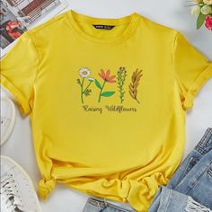 Raising Wildflowers Graphic T-Shirt Top Large - New With Tags - Soft And Stretchy - Size Large (Bust 43in Length 26in) Rs Trendy Crew Neck Tops With Plants Print, Yellow Plants Print Short Sleeve T-shirt, Yellow Short Sleeve T-shirt With Plant Print, Yellow Graphic Tee With Floral Print, Yellow Floral Print Cotton T-shirt, Yellow T-shirt With Plant Print For Summer, Yellow Plant Print Summer Top, Casual Crew Neck Top With Plants Print, Graphic Tee With Plant Print Crew Neck