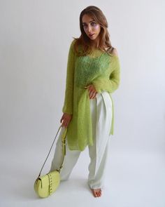 Hello, I'm the one, who won't let you down - lime green mohair tunic.I will comfort you, keep you warm and will make you smile. I'm 100% hand made and proud of that. I consist of 70% italian kid mohair and 30% of nylon, which makes me incredibly natural. I'm quite unique as could be worn all year long.I'm in one size and one size fits all because my measurements are :❤️   Width -50 cm❤️   Lengths -86 cmIf you would like me in other size, you could request a custom order with your own parameters, Trendy Green Open Knit Sweater, Oversized Green Sweater For Spring, Oversized Asymmetrical Spring Sweater, Oversized Asymmetrical Sweater For Spring, Green Layering Sweater For Spring, Green Mohair Knitted Sweater, Spring Casual Mohair Sweater, Casual Mohair Sweater For Spring, Chic Fine Knit Green Sweater