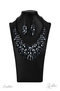 THE HEATHER - 2020 ZI NECKLACE Row after row of metallic blue beads swing from an edgy net of glistening gunmetal links, layering into an edgy fringe below the collar. Featuring flashy faceted edges, the mesmerizing beads spark and sizzle into a conflagration of sparkle below the collar. Features an adjustable clasp closure.Named after 2020 Rock the Runway winner, Heather M. Sold as one individual necklace. Includes one pair of matching earrings. Z2007 2020 SIGNATURE COLLECTION ZI NECKLACE Edgy Fringe, Paparazzi Accessories, Metallic Blue, Paparazzi Jewelry, Blue Necklace, Boutique Jewelry, Blue Beads, Necklace Earring Set, Jewelry Party