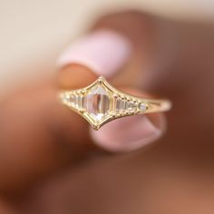 Art Deco inspired engagement ring with one of a kind rose cut diamond and an assemblage of gradient in size baguette cut diamonds from each side. This ring is beaming with light and elegance! MATERIALS: 18k gold | 0.7 carat duchess shape hexagon step cut diamond (OOAK) | assemblage of 10 gradient in size baguette and carre cut diamonds YELLOW 18k gold. Diamond total carat weight: 0.84 Band width: 2 mm Ready to ship in 2-3 weeks. All of our items are MADE TO ORDER, so we need some time to create Luxury Rose Cut Diamond Ring With Baguette Shape, Luxury Diamond Ring With Rose Cut Baguette Diamonds, Luxury Baguette Cut Diamond Ring With Rose Cut Diamonds, Luxury Baguette Cut Rose Cut Diamond Ring, Asscher Cut Diamond Ring With Baguette Diamonds For Promise, Diamond Ring With Baguette Diamonds In Octagon Shape, Modern Rose Cut Diamond Ring For Wedding, Baguette Cut Diamond Ring With Rose Cut Diamonds, Baguette Cut White Topaz Promise Ring