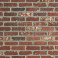 a brick wall that has been made with red bricks and brown mortars on it