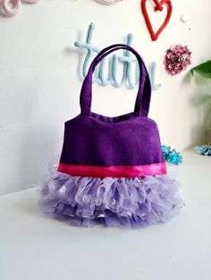 Refresh your accessory selection with our sassy tote bag. This cute cotton fabric tote features a snap enclosure and 1 main compartment to store all of your belongings. The Tote bagpurse measures approximately H13cm x W14cm. Its suitable for Children Ages 2 to 5years.It is made from 100% Cotton Canvas Fabric with 3 layers of soft Tulle and text is heat pressed using glitter vinyl. You can also drop me a message if you want this design in a different colour. Toddler Tote Bag, Toddler Purse, Sewing Easy, Sewing Easy Diy, Crochet Stitches For Blankets, Toddler Bag, Purple Purse, Sewing Bags, Girls Handbags