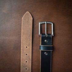 A Leather Belt Made with Care and Intention.Wear this black leather belt in the boardroom, at the pub, or while zip-lining through a forest canopy. Our full-grain leather provides a comfortable fit and our lifetime guarantee means decades of use. As soon as you pick up your belt you will know what quality and craftsmanship feel like. This is something you can't find in a big box store.Our full-grain leather develops a rich patina and fits better over time. We take the time to burnish and polish Adjustable Leather Belt Buckles For Business, Adjustable Black Leather Belt Buckles, Adjustable Black Leather Belt Buckle, Black Leather Belt Buckle With Clip, Adjustable Leather Belt Buckles With Leather Strap, Classic Black Belts And Suspenders With Belt Clip, Black Leather Belt For Everyday Use, Adjustable Black Belt With Leather Strap, Adjustable Black Leather Belts And Suspenders