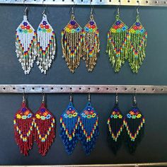 Traditional Mexican Handmade Huichol chaquira (beaded) earrings made by Mexican artisans in the Mexican state of Chipas. The earrings are lightweight, colorful and sure to bring you lots of compliments.  The length is approximately 3.5 inches and 1.5 inches wide. Traditional Green Teardrop Beaded Earrings, Traditional Colorful Beaded Earrings For Festival, Festive Multicolor Beaded Earrings With Latkans, Bohemian Earrings With Colorful Beads For Celebration, Traditional Multicolor Beaded Earrings, Multicolor Beaded Earrings With Latkans As Gift, Artisan Beaded Earrings With Round Beads For Festivals, Adjustable Multicolor Handwoven Beaded Earrings, Traditional Colorful Round Bead Earrings