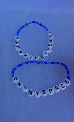 two beaded bracelets with words that spell out the word'my space '