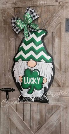 a wooden door with a green and white sign that says lucky