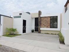 a white house with black doors and windows