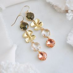 "Flower Earrings // Boho Bridal Earrings // Statement Wedding Earrings // Whimsical Earrings // 14k Gold Filled Earrings // Western Wedding These beautiful hazel brown, crystal and rose peach boho bridal earrings match the natural allure of either a western wedding or woodland wedding. The faceted glass are set inside of raw brass which have a warm patina finish adding to their vintage appeal and the faceted hazel brown have an open back allowing the light to filter through shifting their colora Green Flower Shaped Jewelry For Wedding, Gold Dangle Flower Earrings For Bridesmaids, Green Flower Shaped Wedding Jewelry, Green Flower-shaped Wedding Jewelry, Green Round Flower Earrings For Wedding, Rose Gold Flower Earrings For Wedding, Green Flower Wedding Earrings, Round Flower Earrings With Ear Wire For Wedding, Gold Dangle Flower Earrings For Wedding