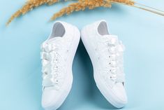 "Now all our wedding sneakers with free express shipping upgrade to USA, Canada and Europe : 2-4 business days transit time always.You can have your shoes pretty fast with guranteed transit times by DHL express. New faster production time.Everything is shipped in 1-2 weeks. Made with love for your wedding day by Lovin Bridal - More Wedding shoes at our shop : http://lovincollection.etsy.com It's the bride's prerogative to wear the comfiest wedding shoes. If you're set on heels then one option is to have your Lace Converse as a second pair of bridal shoes to change into for the reception. There are so many options for your wedding sneakers - go for white or ivory for a twist on the traditional, or a pop of colour to make your Bride Converse a standout feature. You can personalize them howev White Sneakers With Laces For Bridal Shower, White Low-top Wedding Shoes For Bride, Lace-up Wedding Shoes With Laces For Bride, Lace-up Wedding Shoes For Bride, White Lace-up Wedding Shoes With White Laces, White Lace-up Wedding Shoes, White Low-top Wedding Shoes For Bridal Shower, White Round Toe Sneakers For Bridal Shower, Low-top Lace Wedding Shoes For Bride