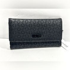 Product Details Care Instructions Dry Cloth Clean Closure Type Snap Lining Faux Leather About This Item Tri-Fold Slim Clutch Wallet Debossed Logo Design Smooth Faux-Leather Fold-Over Flap Closure Monochrome Logo Emblem Description This Chic Faux-Leather Clutch Wallet From Guess. Featuring An Allover Logo Print, Fold-Over Flap Closure And Exterior Zip Pocket At Back. Black Embossed Wallet For Everyday Use, Trendy Black Formal Wallet, Monochrome Logo, Bags Guess, Leather Clutch Wallet, Debossed Logo, Logo Emblem, Guess Bags, Emblem Logo