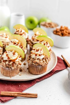 there are many muffins with apples on the plate