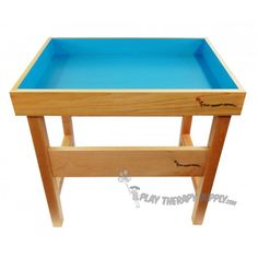 a wooden table with a blue tray on it's legs and bottom shelf for storage