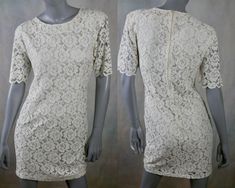 This 1970s cream floral lace dress has a collarless slight scoop neckline and short sleeves, and the fitted waistline gives way to an A-line drop to an above-the-knee hemline. The dress is lined in a white satin acetate fabric, and a 16-inch zipper in the back makes dressing an ease. Made in Italy. Size 6 US, 10 UK Bust = 34 inches (86.36cm) Shoulders = 16 inches (40.64cm) Waist = 30 inches (76.2cm) Hips = 38 inches (96.52cm) Sleeve Length = 10 inches (25.4cm) Dress Length = 35 inches (88.9cm) M Cream Short Sleeve Lace Dress, Short Sleeve Cream Lace Dress, Fitted Lace Dress With Lace Collar For Spring, Spring Cream Lace Dress With Scalloped Edges, Spring Cream Lace Dress With Scalloped Lace, Cream Scalloped Lace Dress For Spring, Feminine Beige Lace Dress With Short Sleeves, Beige Short Sleeve Feminine Lace Dress, Feminine Beige Short Sleeve Lace Dress