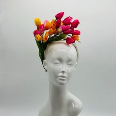 Handmade by Featured Milliner of The Kentucky Derby Museum 2023 & 2024! Spring has sprung! This is the perfect spring piece! Beautiful dark pink, yellow and light pink tulips with pops of green. Can be worn on either side! Attaches with headband.  Not taking customs this year--Derby 150 is going to be massive and mom life keeps me running! However, happy to suggest pieces that will coordinate with your outfit. If you don't love the way this attaches to your head--message me!  I can swtich *most* pieces to your preference. Clip, Headband OR Elastic Cord  NOTE: Heavier pieces with extravagant florals etc require the stability of a headband. NO RETURNS/EXCHANGES due to nature of product (special occasion and head wear). Not all screens/lighting are created equal. Make sure you are happy with Pink Spring Fascinator With Structured Crown, Pink Fascinator With Structured Crown For Spring, Pink Structured Crown Fascinator For Spring, Spring Multicolor Hat Fascinator, Pink Spring Headpiece With Structured Crown, Spring Multicolor Fascinator, Spring Pink Headpiece With Structured Crown, Pink Structured Crown Headpiece For Spring, Multicolor Mini Hat Headband For Spring