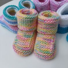 Beautiful Hand Knitted Babies Booties These has been lovingly hand knitted in baby soft dk yarn. Knitted in a variety of colours with more to come these baby booties will make the perfect gift for your baby or an expectant mother.  Featuring a long sock like top which can be left up or folded down. Suitable for babies 0 - 3 months as a guide. Many more colours to come and we also accept custom orders :) Knitted Booties With Round Toe For Gift, Knitted Round Toe Booties As Gift, Cute Yarn Booties As A Gift, Cute Knitted Round Toe Booties, Cute Hand Knitted Round Toe Booties, Cute Yarn Booties As Gift, Cute Hand Knitted Winter Booties, Yarn Booties With Round Toe For Gift, Yarn Booties With Round Toe As Gift