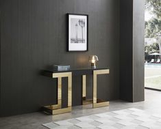 a black and gold console table next to a pool