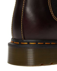 Dr. Martens is 60. And we're paying tribute to our core heritage markings — by cranking them up to the max. Inspired by a design dug out of our archive, we've emphasized the yellow stitching across this boot's uppers. The boots are built from a new premium leather called Atlas — a classic waxed leather with a subtle pull-up and slight sheen. The 2976 is the rugged Docs take on the classic Chelsea boot. Manufactured since the 70s Atlas is a classic waxed aniline leather with a subtle pull-up and Chelsea Boots Dr Martens, Subtle Ombre, Oxblood Leather, Boots Uk, Thick Socks, M 4, Leather Chelsea Boots, Goodyear Welt, Chelsea Boot