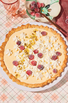 An eggnog chiffon pie and two small plates with sugared cranberries and a pie server, placed on top of a printed tablecloth. Chiffon Pie Recipe, Chiffon Pie, Recipe Developer, Sugared Cranberries, Custard Powder, Bean Paste, Vegan Condiments, Chatelaine, Pie Recipe