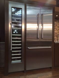 a large stainless steel refrigerator in a kitchen