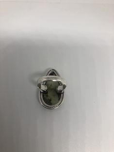 Vintage green moss agate Ornate German Silver Vintage ring, does not tarnish Size 8.25 can be re sized, my jeweler charges a $10 - $15 fee All rings are shipped free in the US in a nice gift box. Check out our over a THOUSAND great reviews Engraving is $4 per letter and is not always perfect depending on the piece. It can take a few days if the jeweler is busy. This is payable to Paypal Judithsltd@gmail.com Silver Moss Agate Ring With Natural Inclusions, Moss Agate Ring With Natural Stones, Handmade Oval Moss Agate Ring, Spiritual Green Ring With Large Stone, Handmade Silver Rings With Moss Agate, Handmade Silver Moss Agate Rings, Unique Adjustable Green Opal Ring, Green Oval Moss Agate Jewelry, Green Moss Agate Oval Jewelry