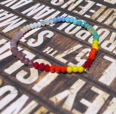 This gorgeous bracelet is a reminder to embrace the rainbows, the little miracles. It's on elastic, nickel free and crimped. Match it with our My Life in Technicolor Ombre Rainbow Crystal Necklace: https://www.etsy.com/listing/1250257337/my-life-in-technicolor-ombre-rainbow?click_key=5c32b651b340ea2bac9e96aec784170f98e67d91%3A1250257337&click_sum=b729c3cd&ref=shop_home_active_10&pro=1&sts=1 One size fits most. Please contact me for any sizing inquiries so that I can best accomdate you. Rainbow Crystal Bracelet, Bear Necklace, Rainbow Crystal, Gorgeous Bracelet, Gummy Bears, Crystal Bracelet, Candy Corn, Cute Cards, How To Make Beads